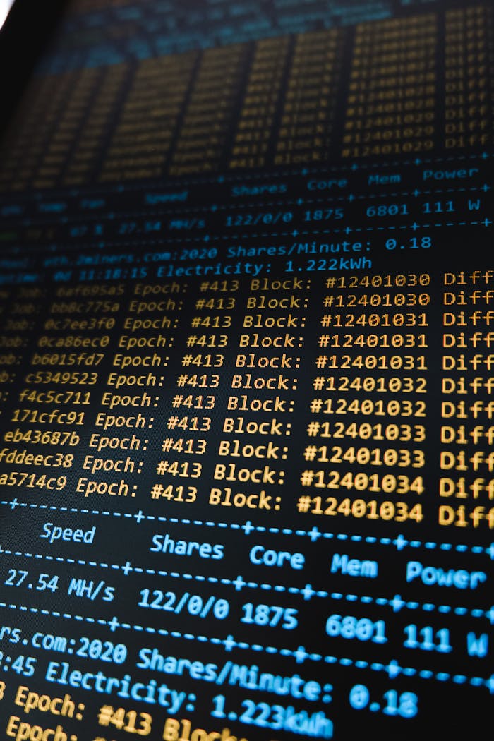 our-services-1 Detailed view of a cryptocurrency mining software interface displaying real-time data on a computer monitor.